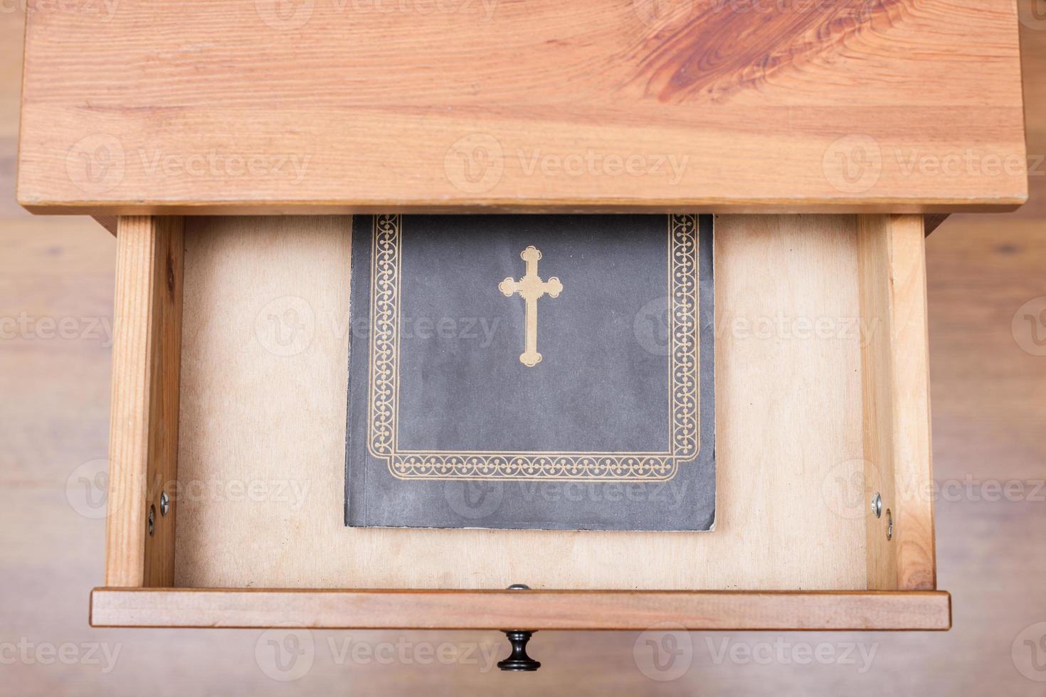 Bible book in open drawer photo