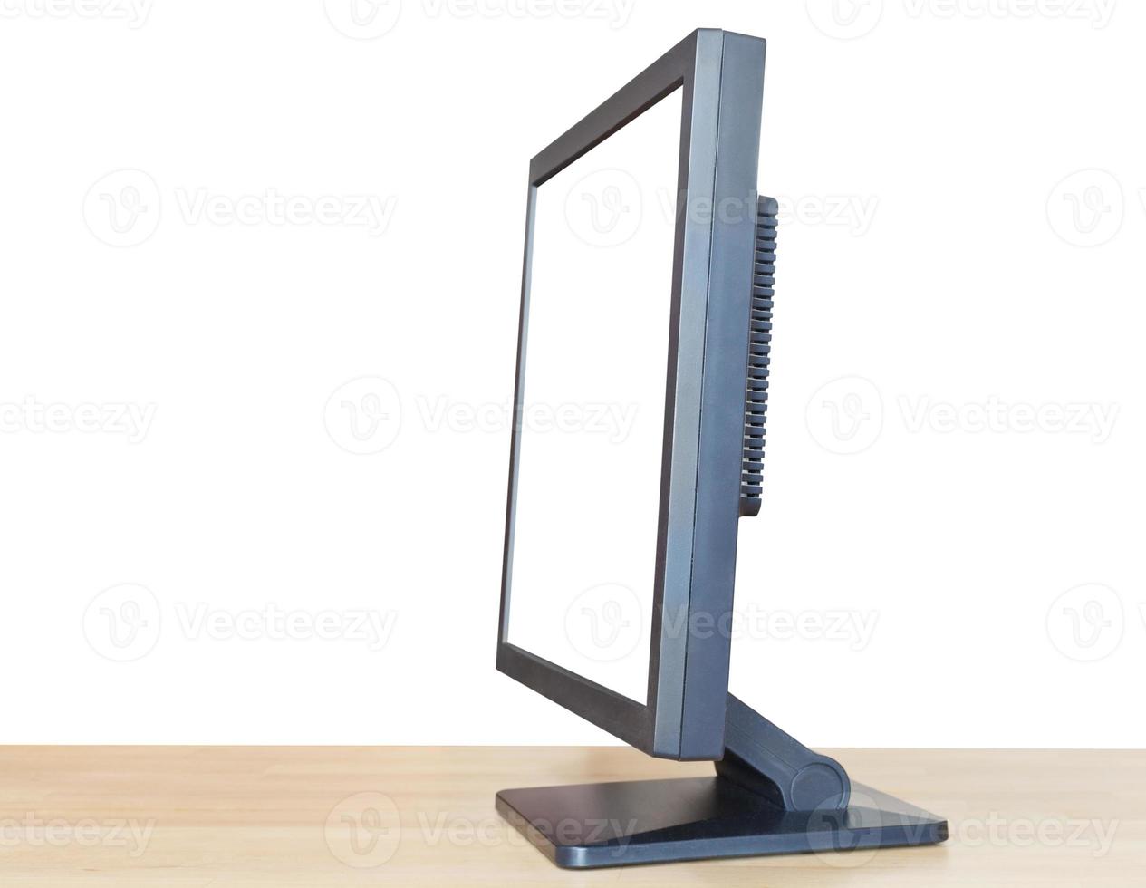 black display with cutout screen on wood table photo