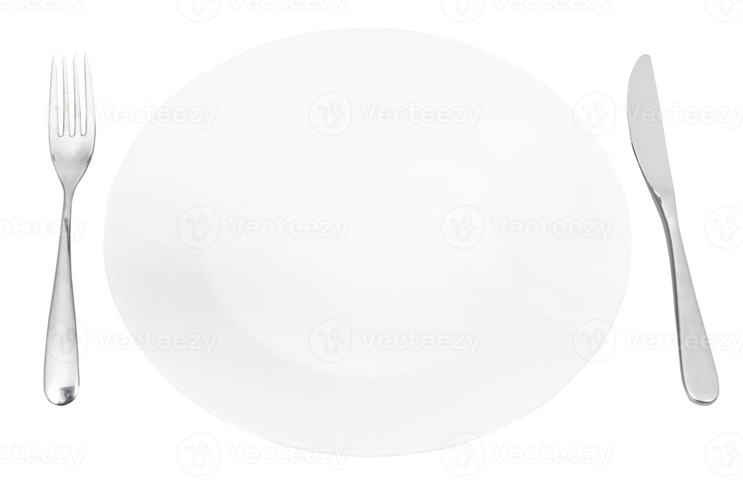empty white porcelain plate with fork and knife photo