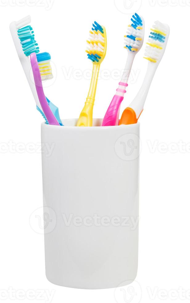 five toothbrushes in ceramic glass photo