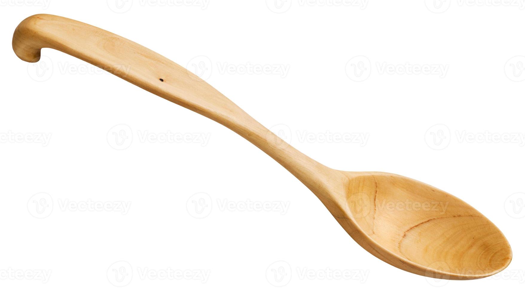 traditional wooden spoon carved from maple wood photo
