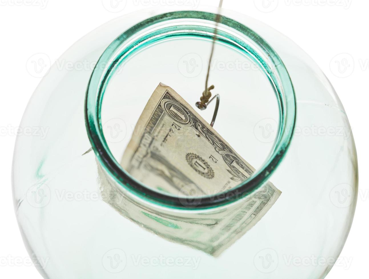 vista superior de atrapar el último dólar del frasco de vidrio foto
