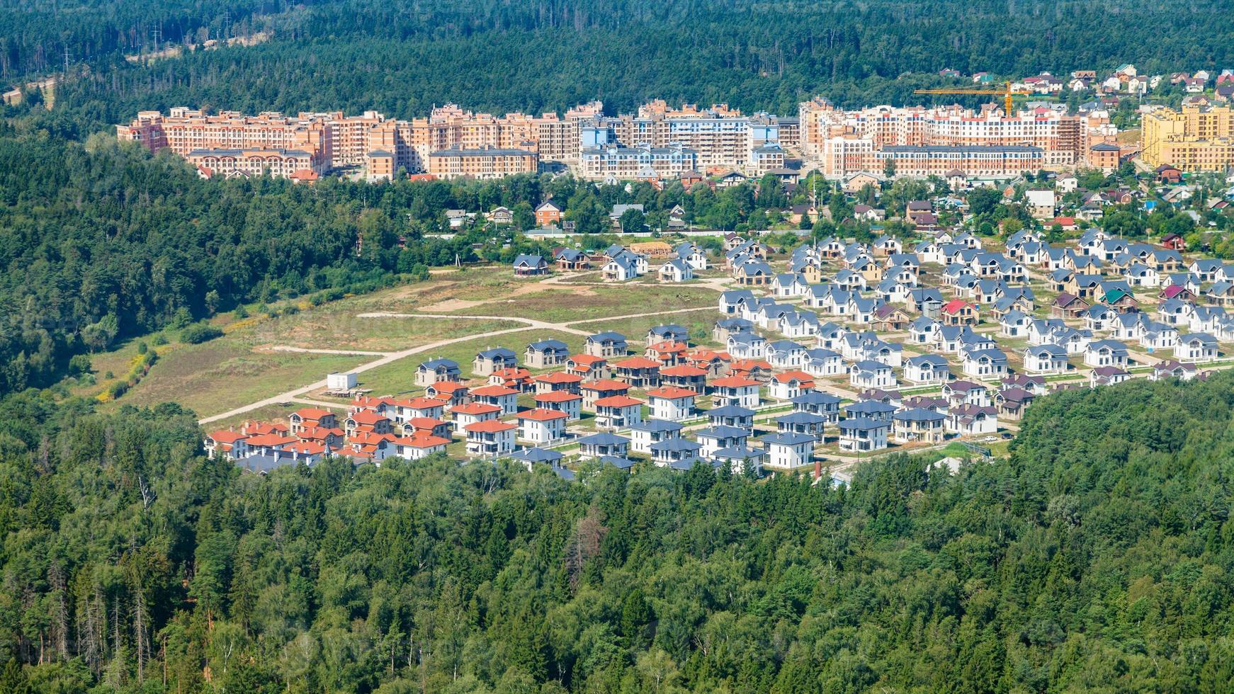 above view of modern cottages and apartment houses photo