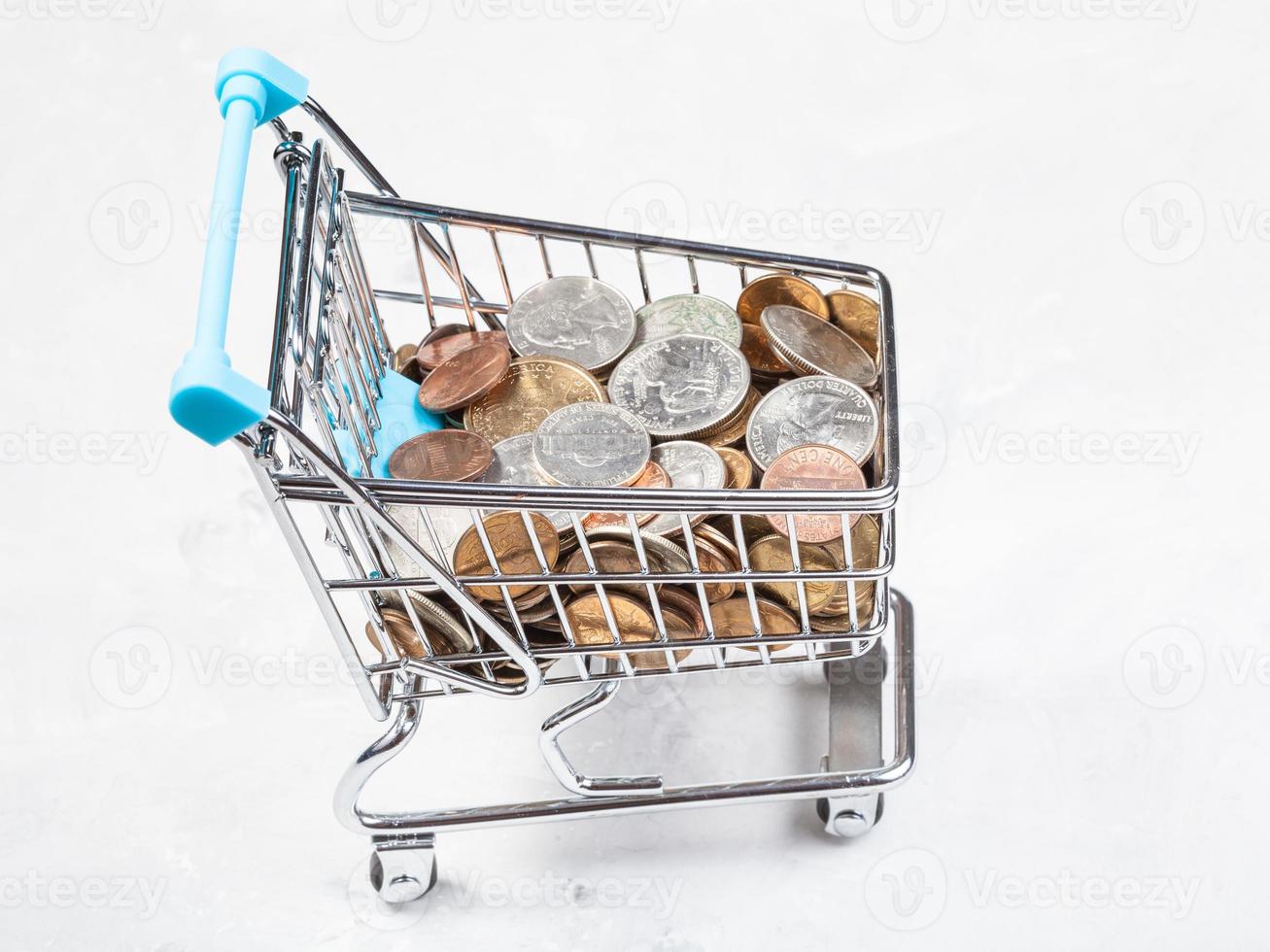 cart with US coins on concrete board photo
