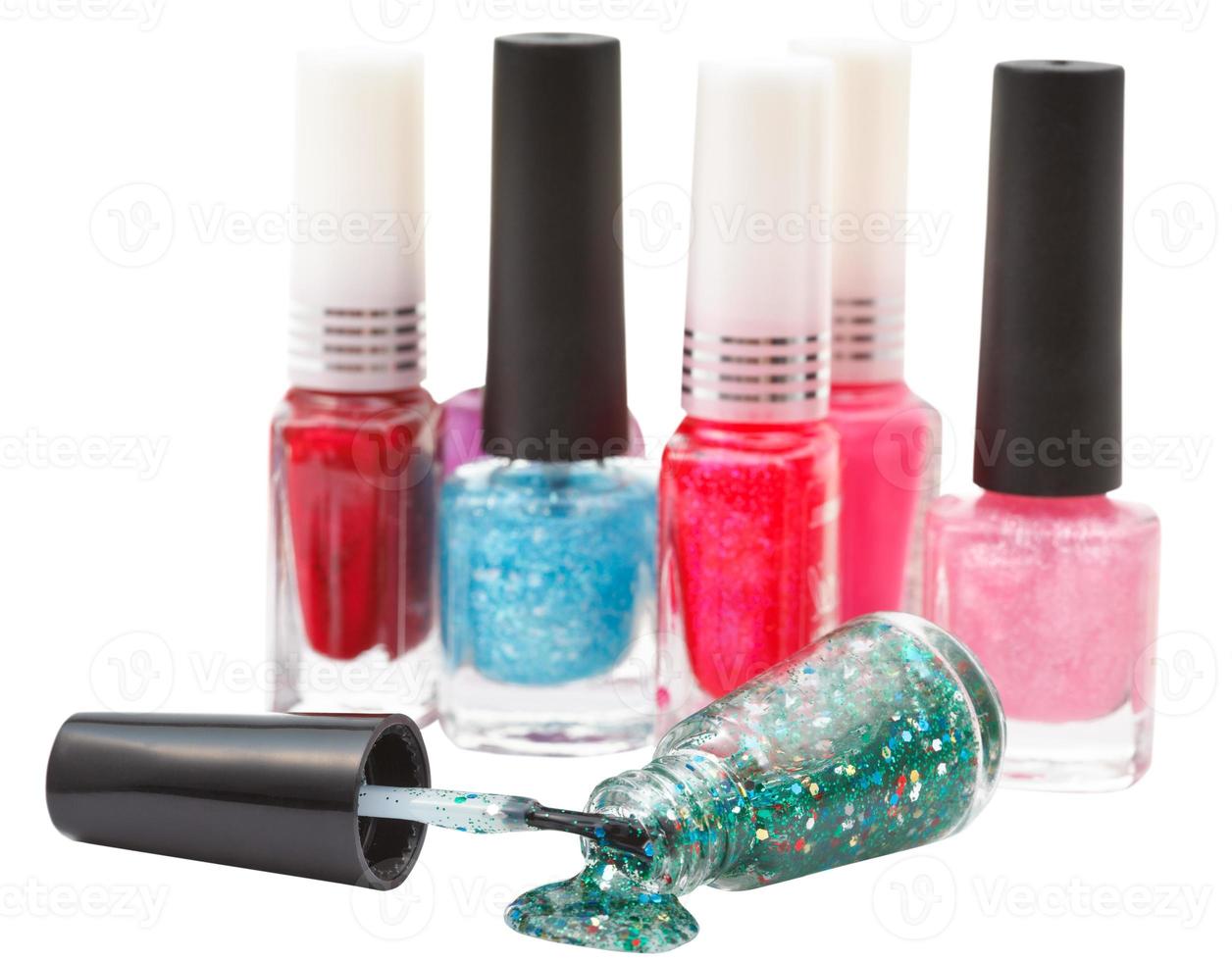nail polish bottles and spilled lacquer isolated photo