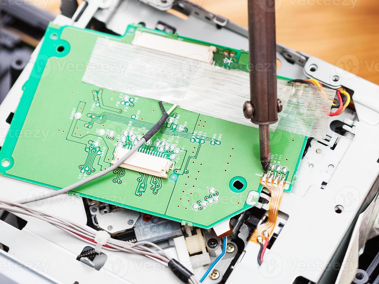 repairing of circuit board with soldering-iron photo