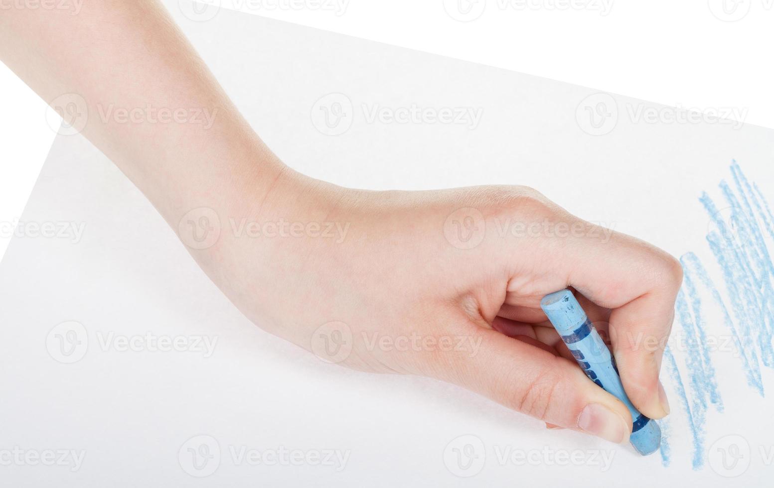 hand draws by blue crayon on sheet of paper photo