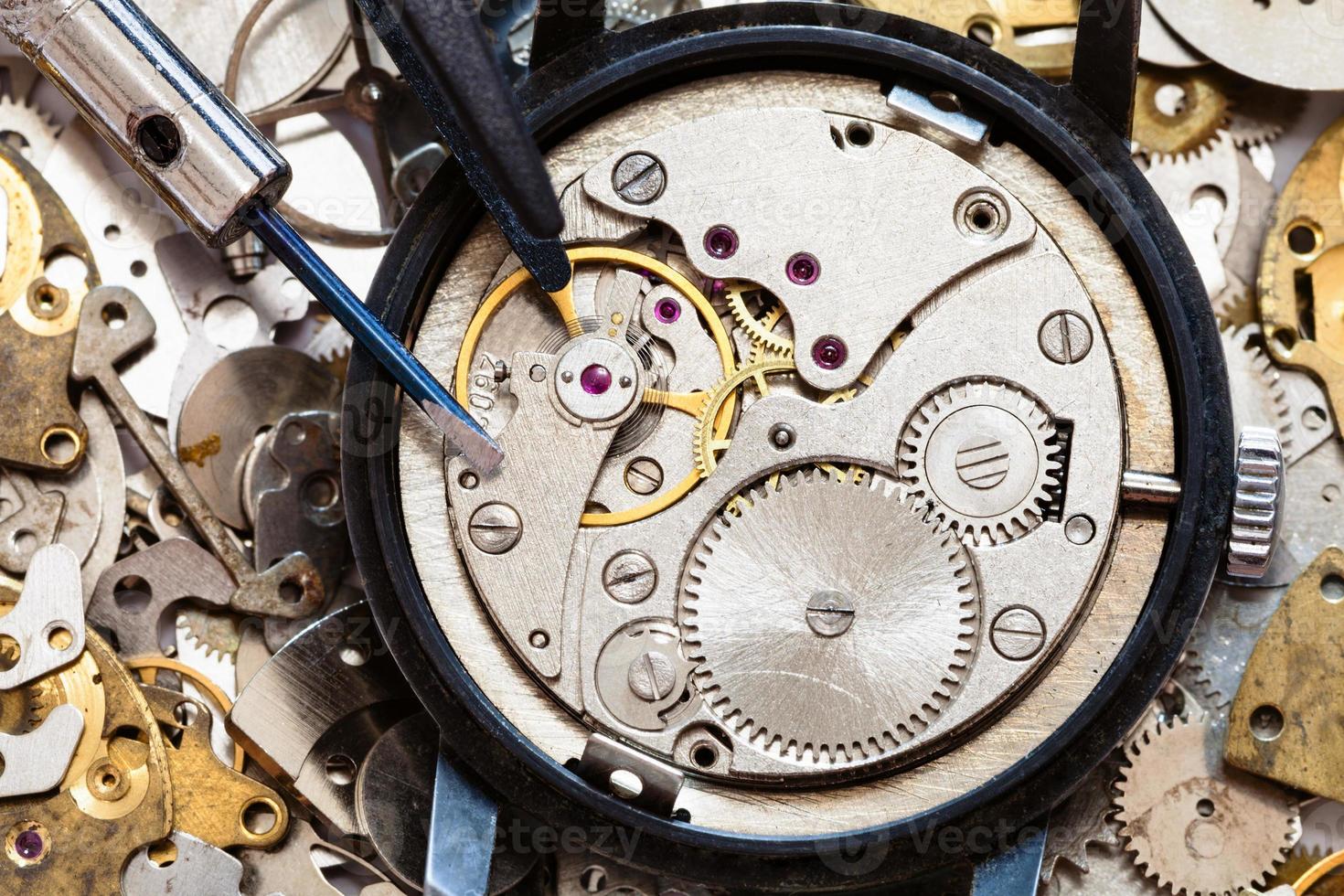 top view of tools on clockwork on spare parts photo