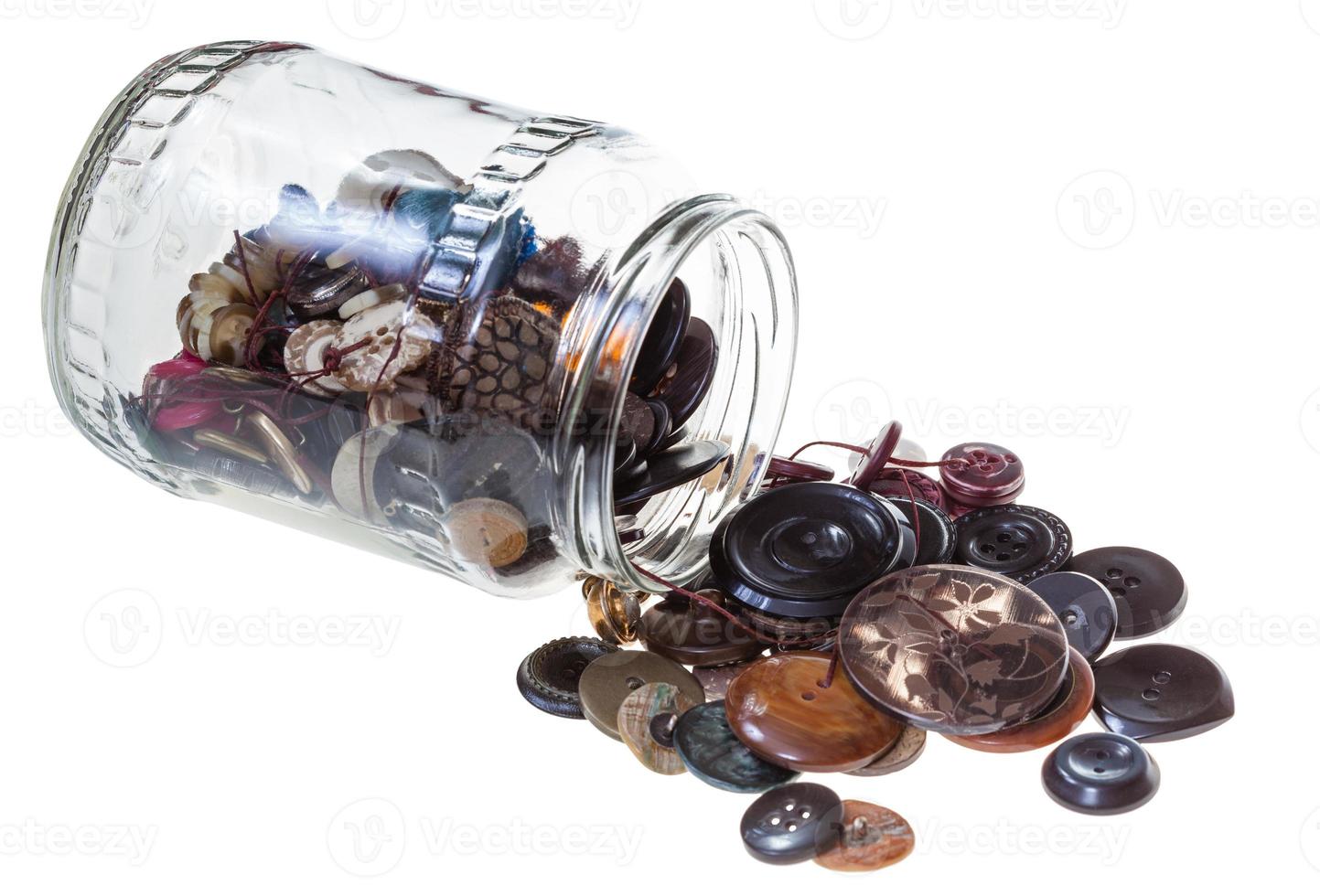 glass jar with sewing buttons isolated photo