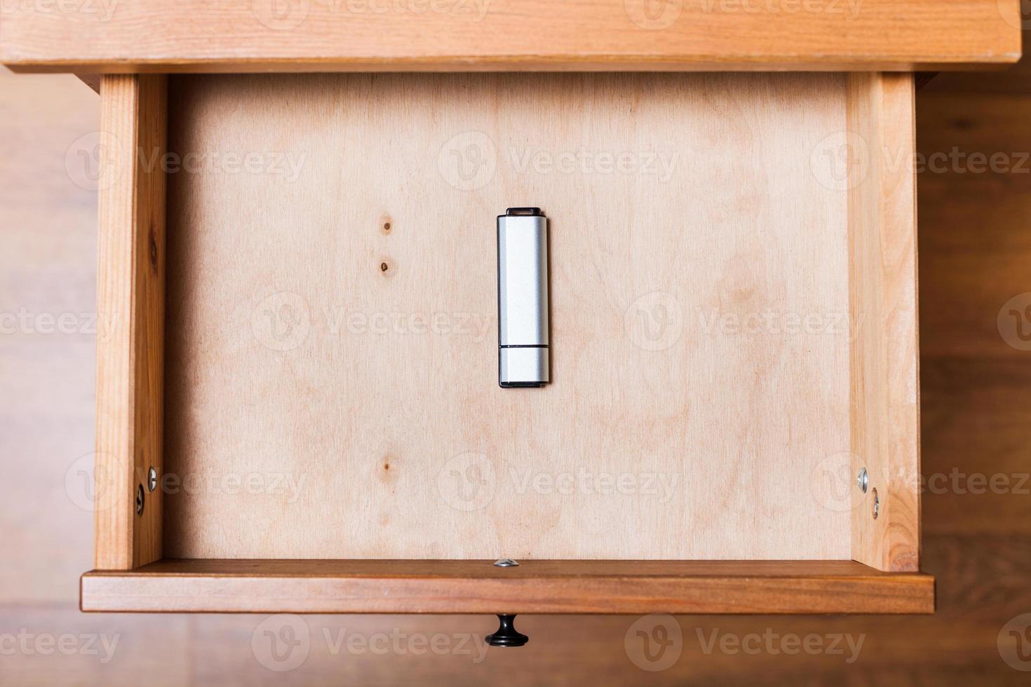 closed flash drive in open drawer photo