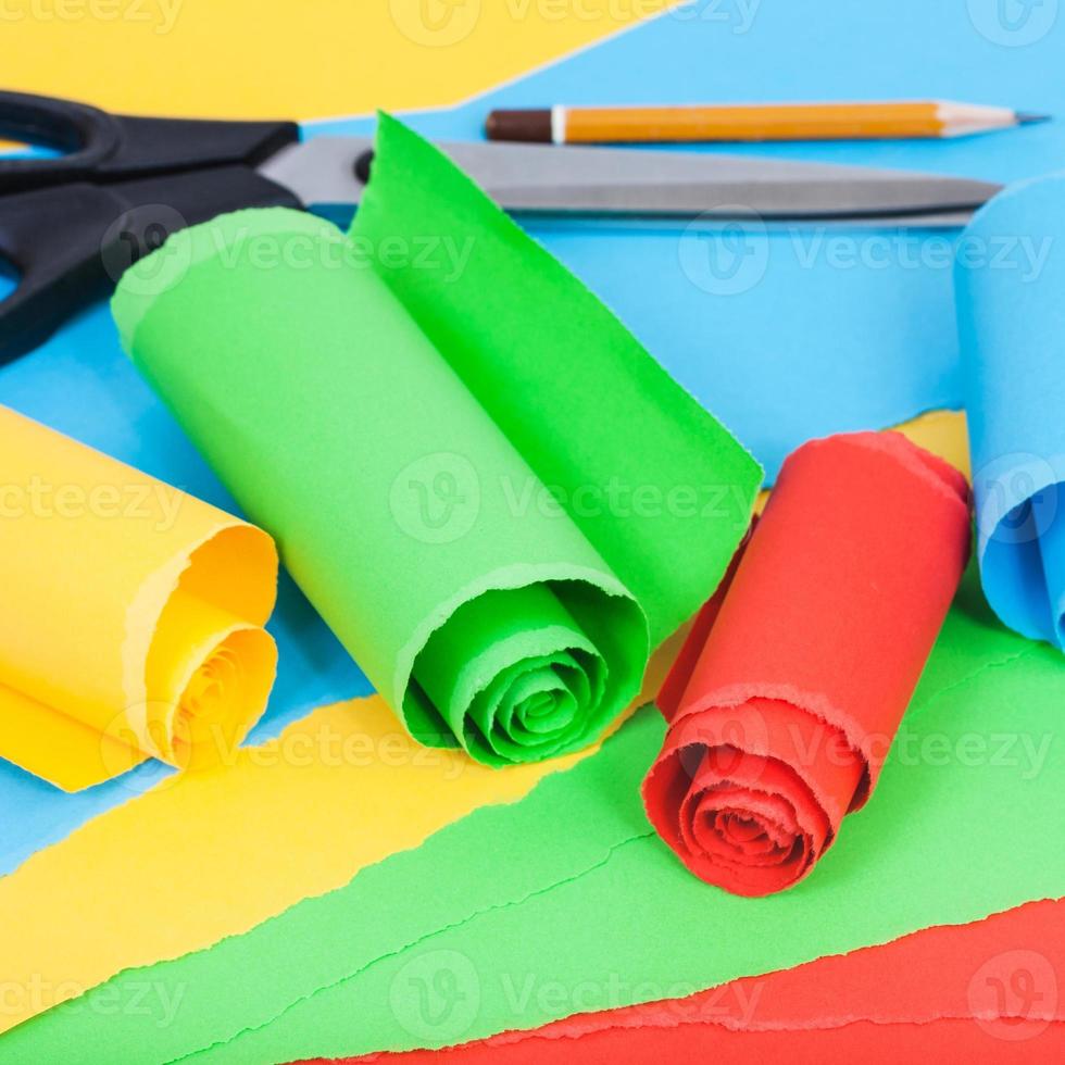 rolled color paper on sheets of plain paper photo