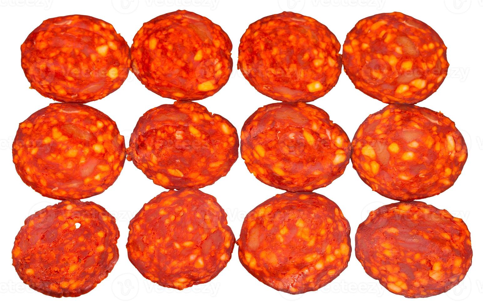 many slices of pepperoni sausage isolated on white photo