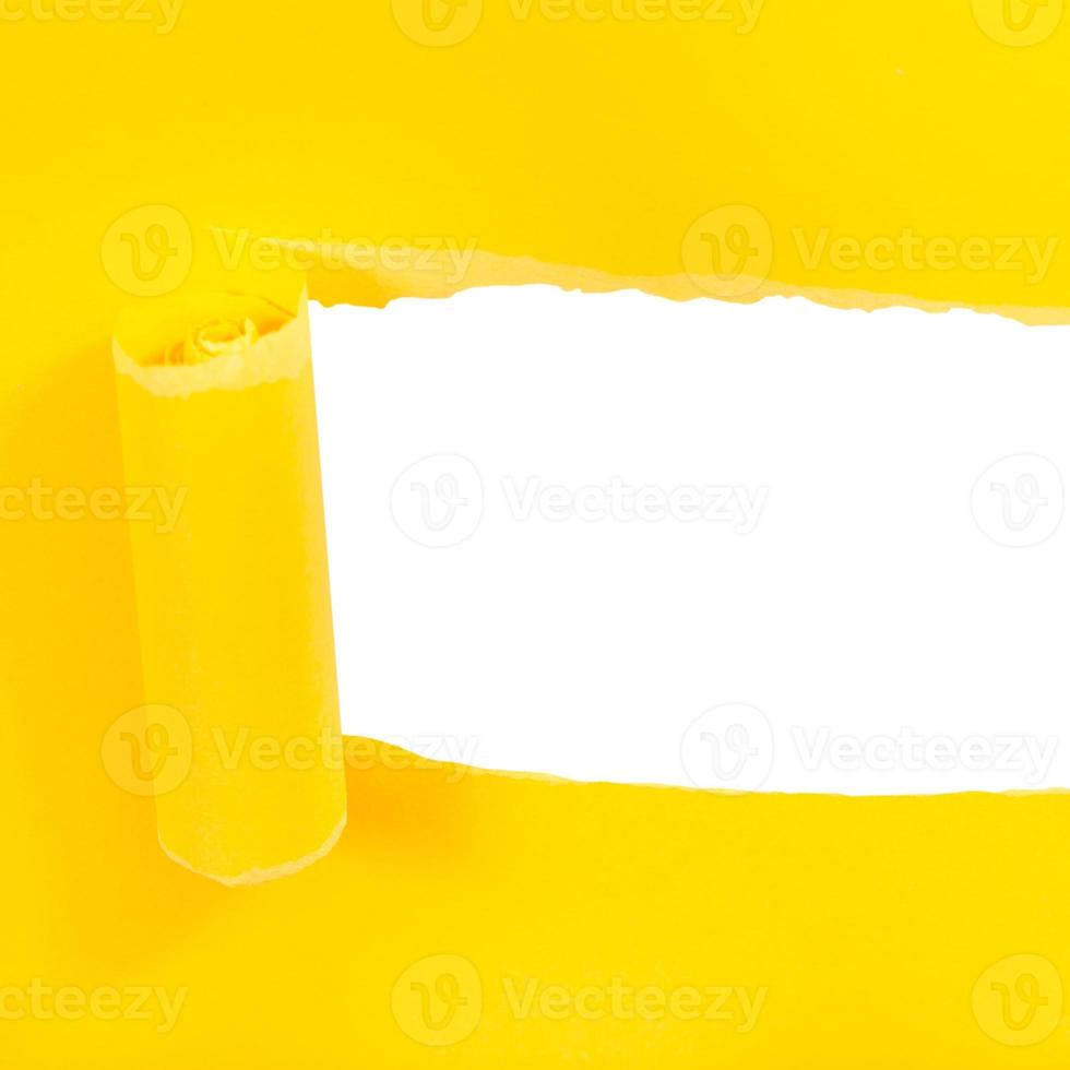 above view of yellow rolled-up torn paper photo