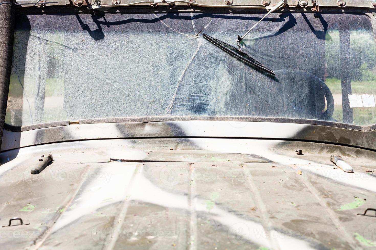 dirty hood and windshield of off-road vehicle photo