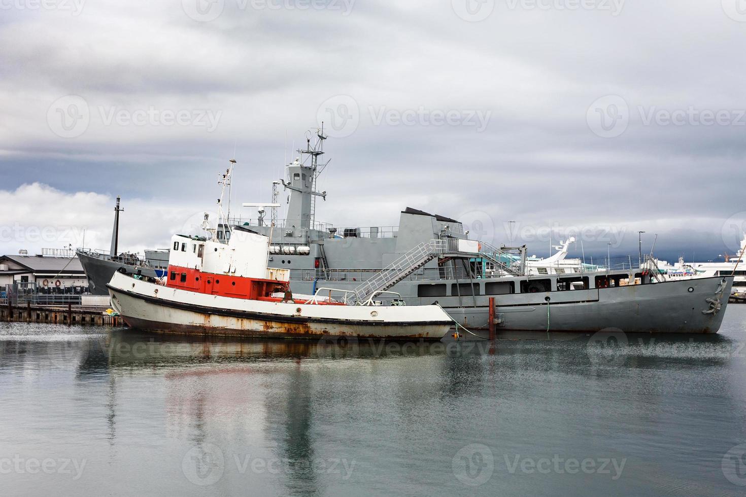 various ships in Reykjavik city port in autumn photo