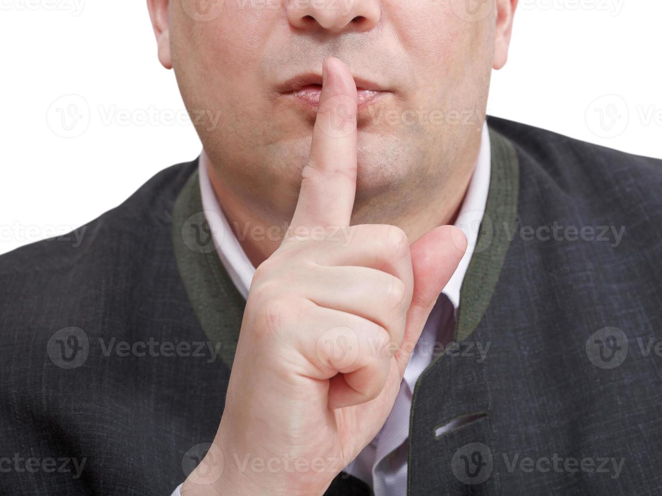 businessman's finger near lips - silencesign photo
