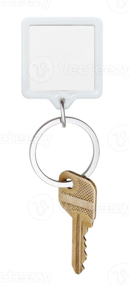 door brass key and square keychain on ring photo