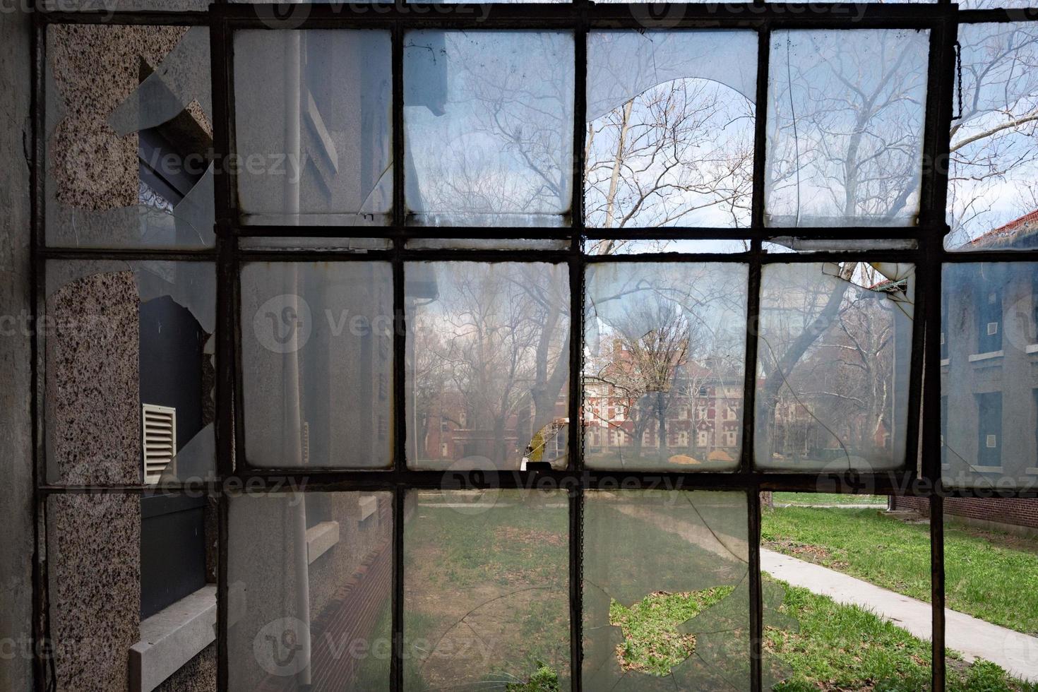 broken windows in ellis island abandoned psychiatric hospital interior rooms photo