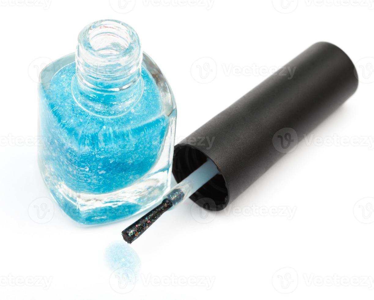 above view of bottle with turquoise nail polish photo