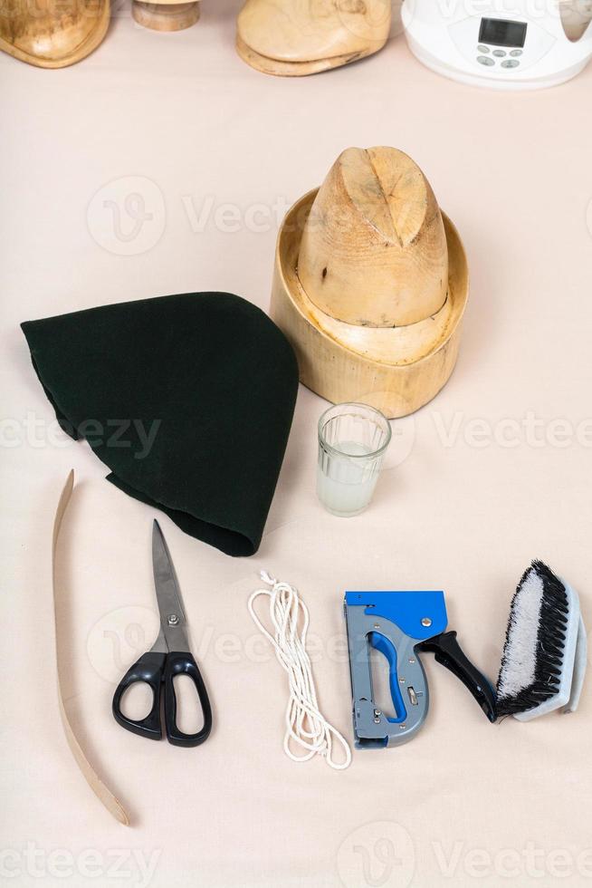 felt hood, wooden hat-block, tools for hatmaking photo