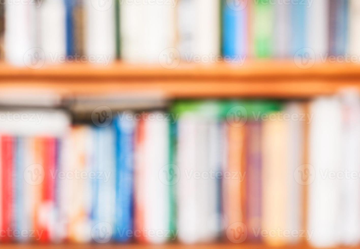 blurred background from books on bookshelf photo