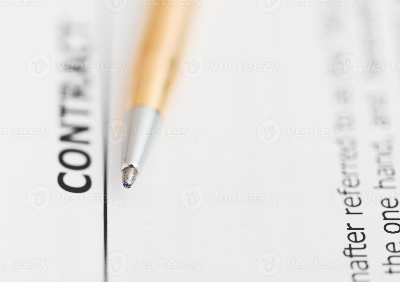 contract and tip of golden pen photo