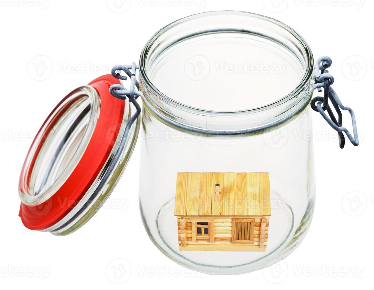 wooden house in glass jar photo