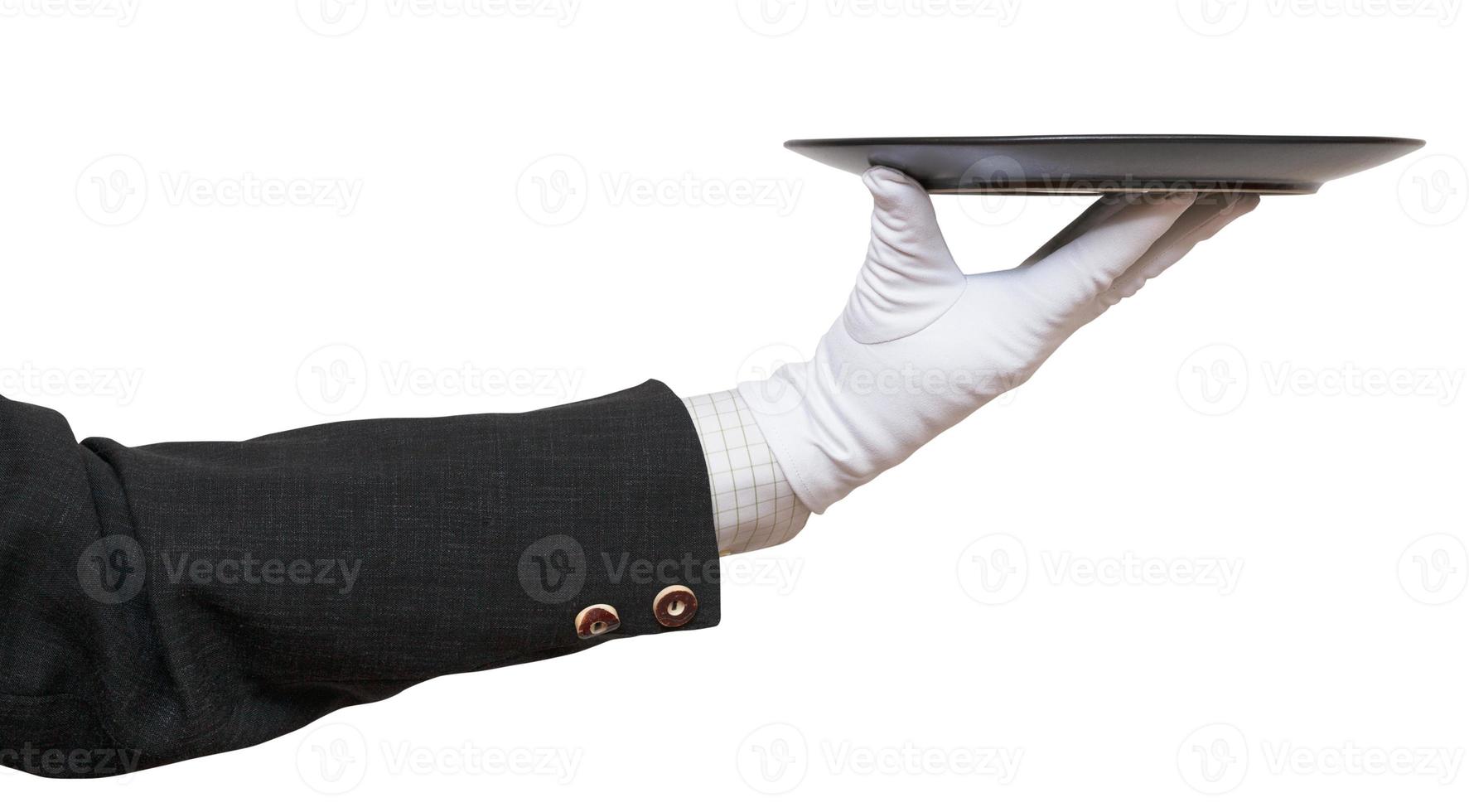 side view of arm in white glove with black plate photo