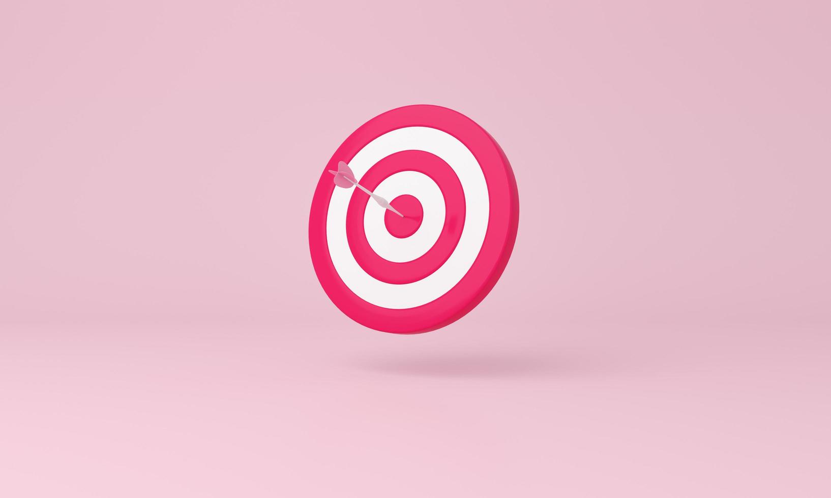 Dart hit the center of target on pink background. Business aiming at the target concept. photo