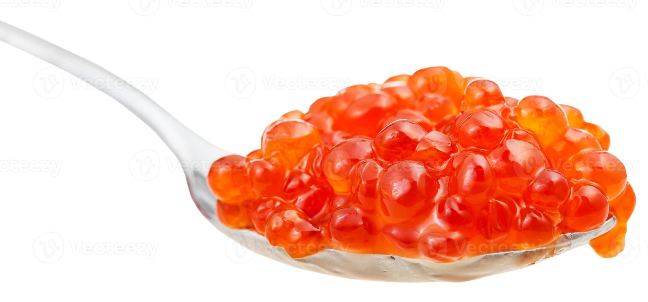 side view of spoon with trout salmon red caviar photo