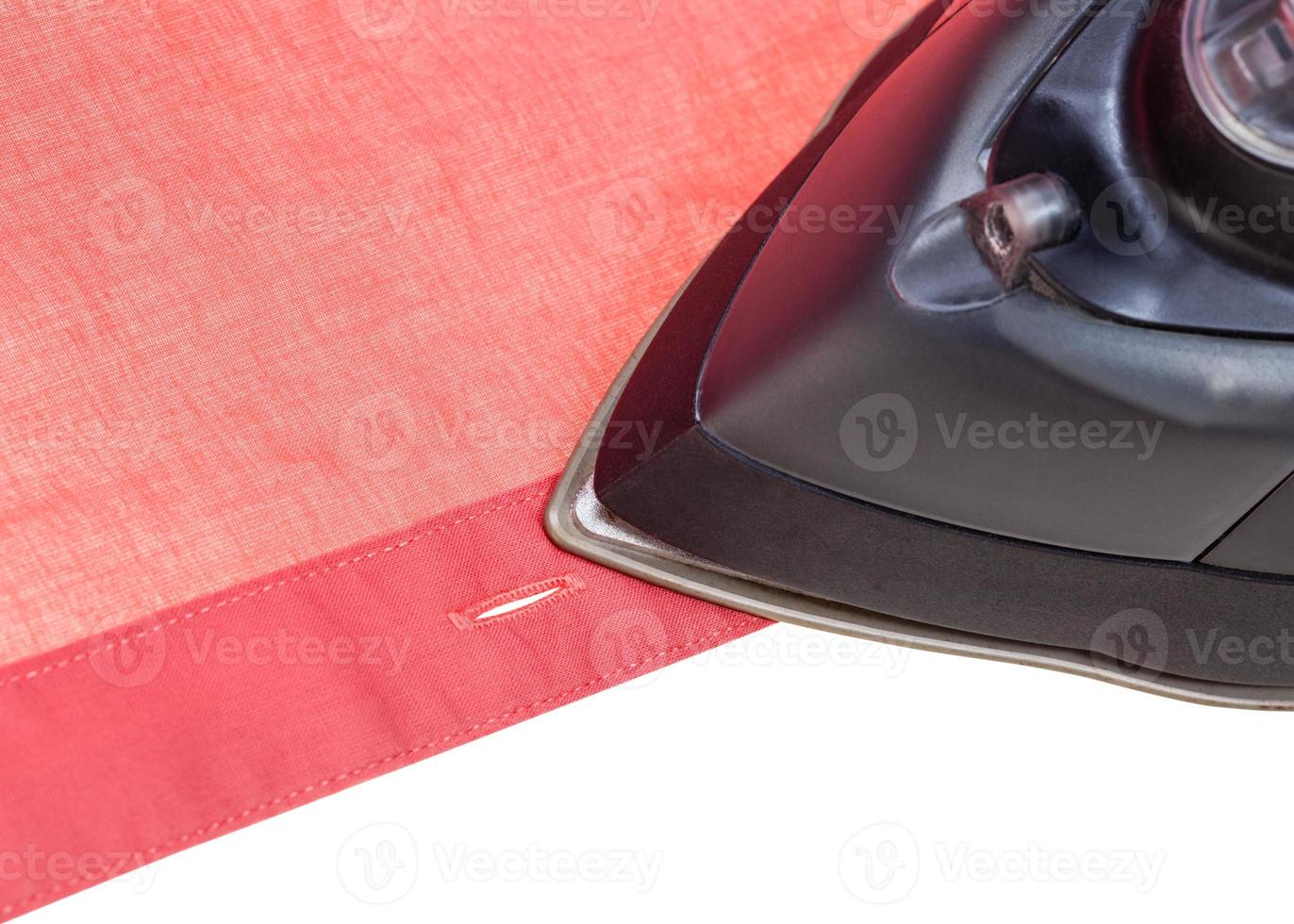 clothing iron ironing red shirt close up photo