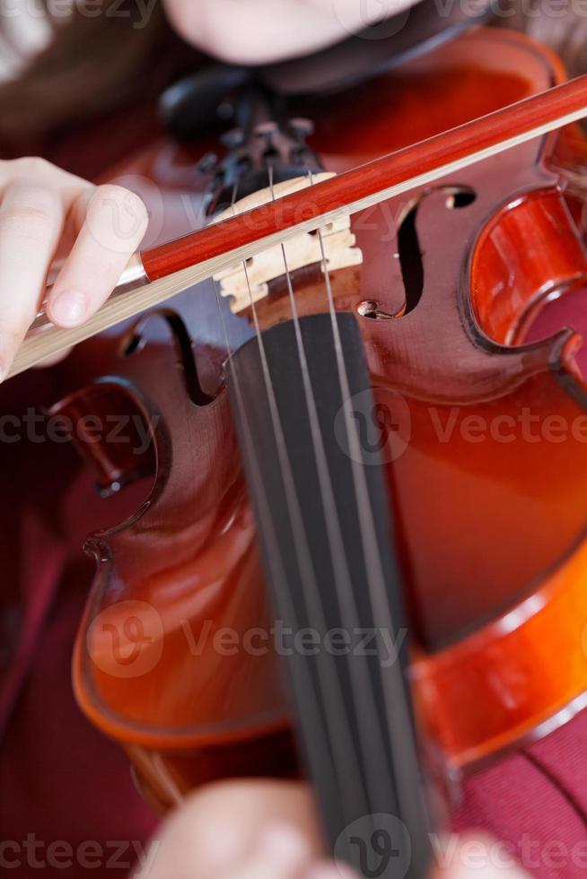 girl playing violin at concert photo