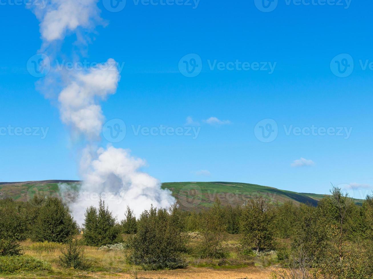 eruption in Haukadalur geyser valley in Iceland photo