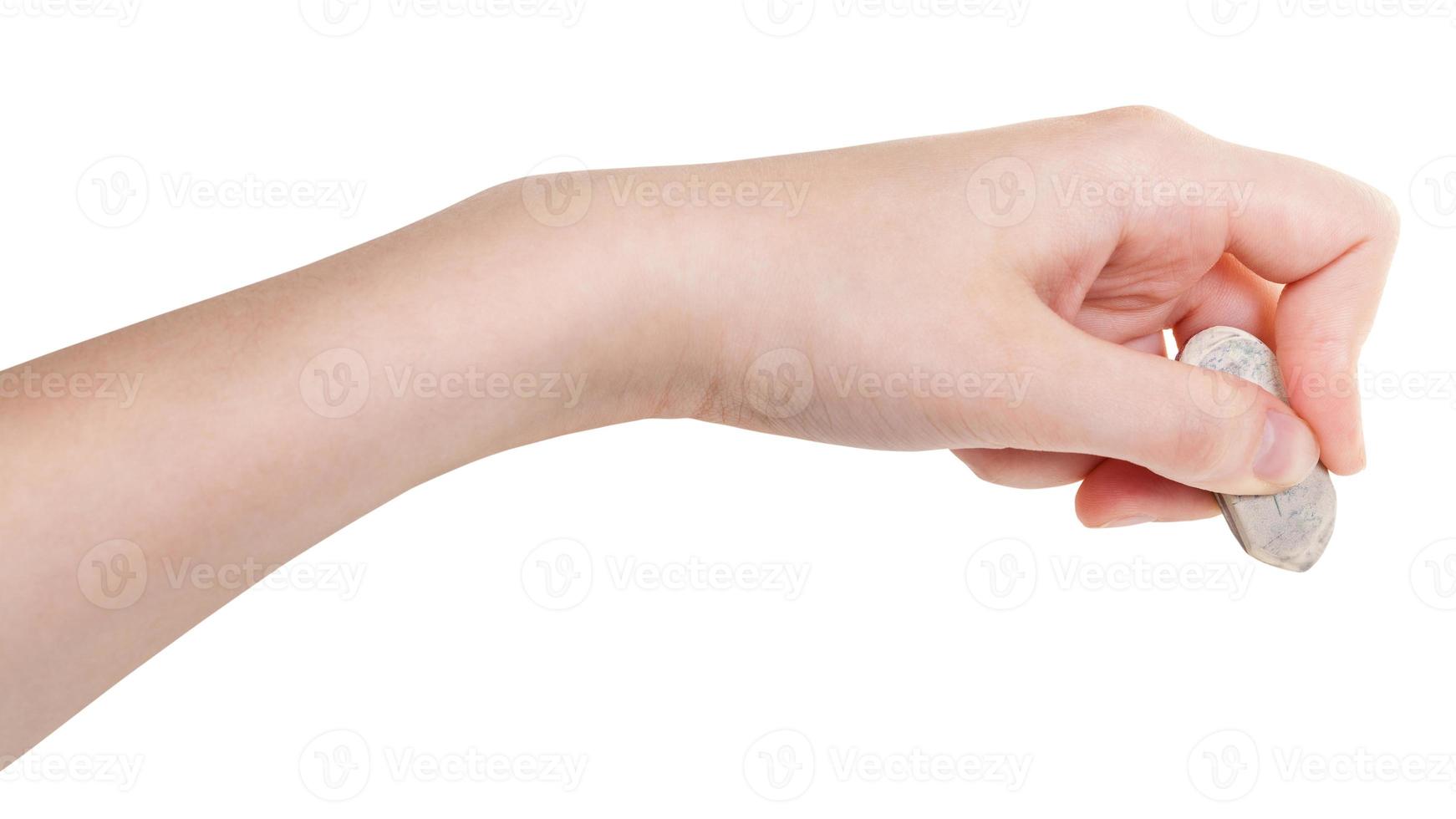 side view of hand with rubber eraser isolated photo