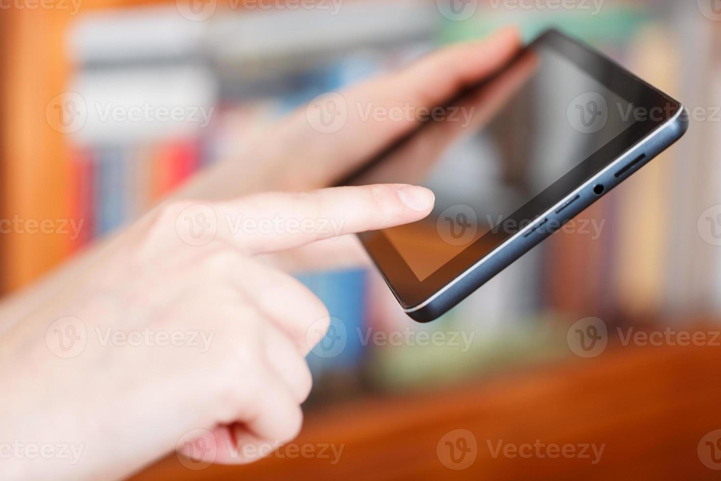 finger touching touchpad in library photo