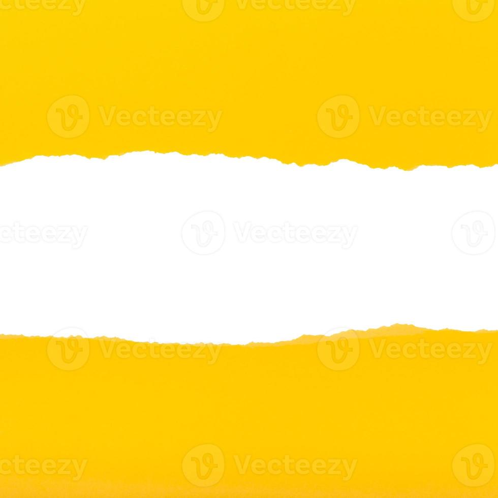 splitted halves of sheet of yellow ripped paper photo
