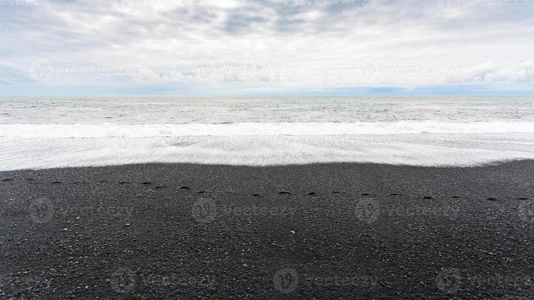 ocean waves on Reynisfjara black sand Beach photo