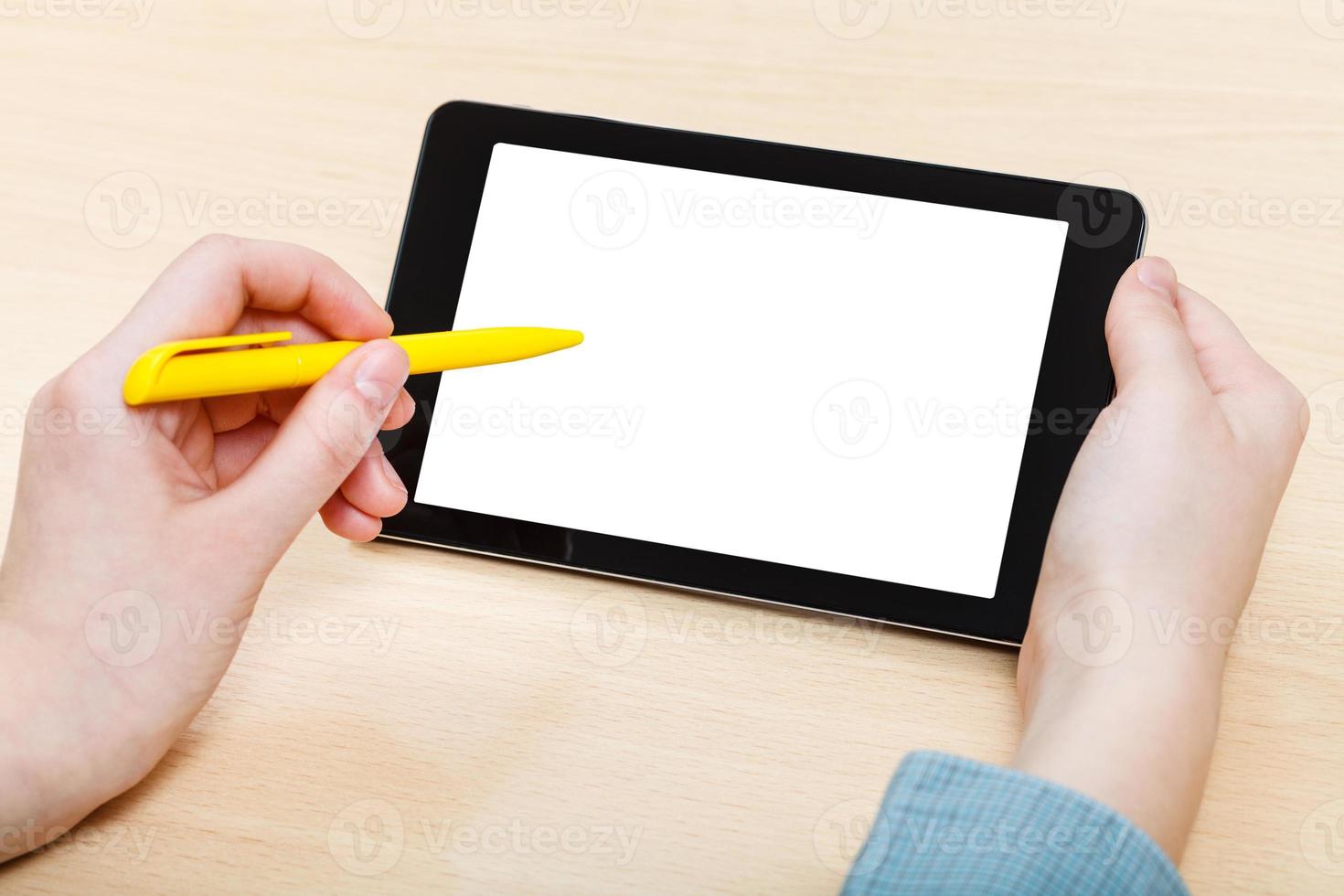 man touches by pen of cutout screen tablet PC photo