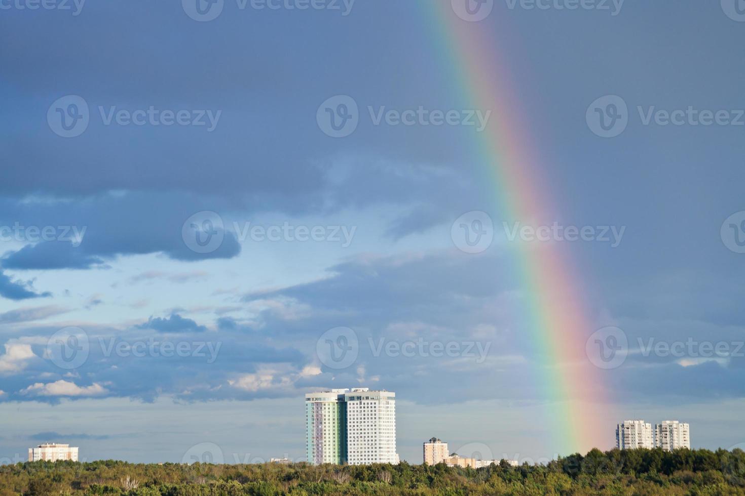 urban skyline with rainbow photo