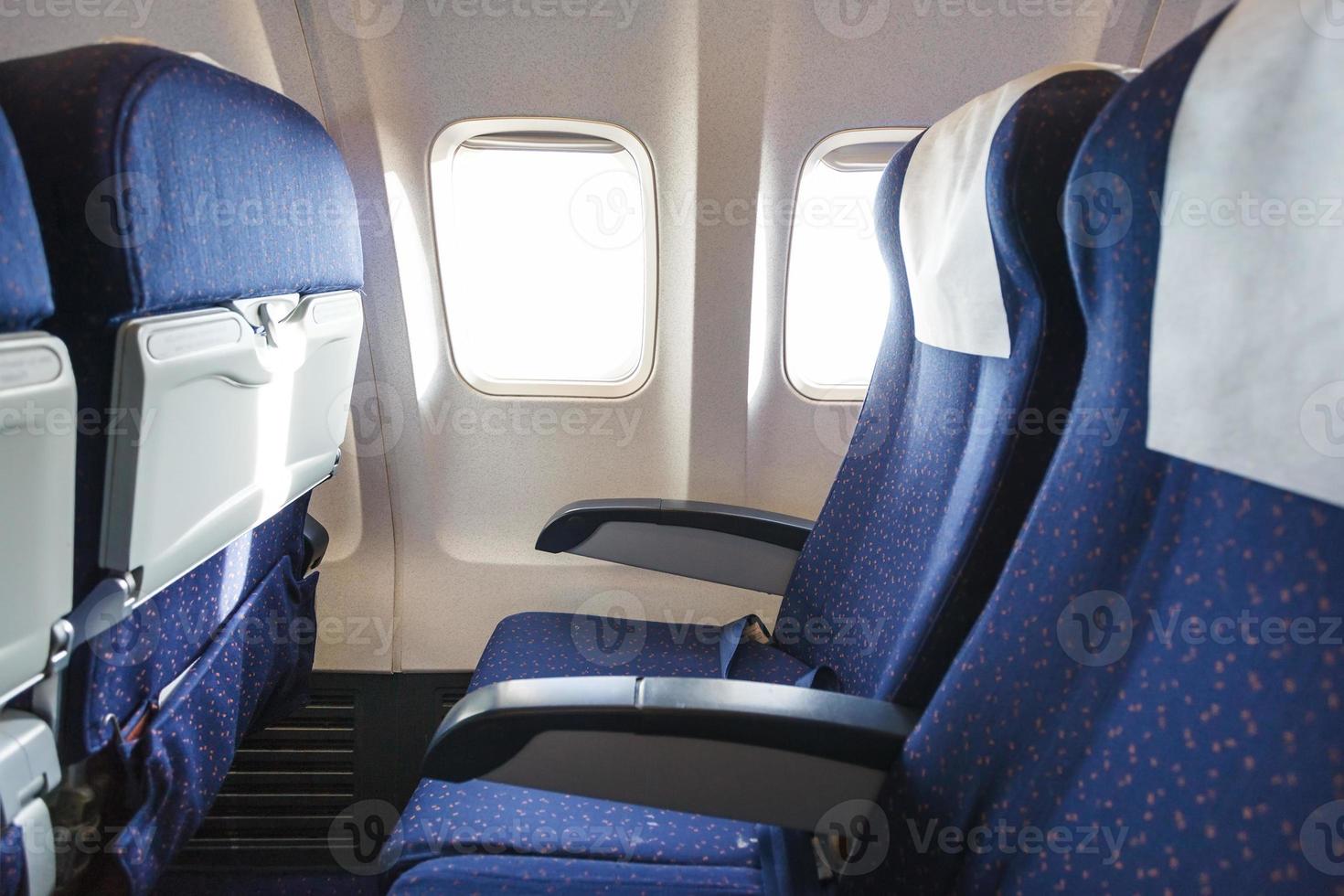 seats in economy class section of aircraft photo