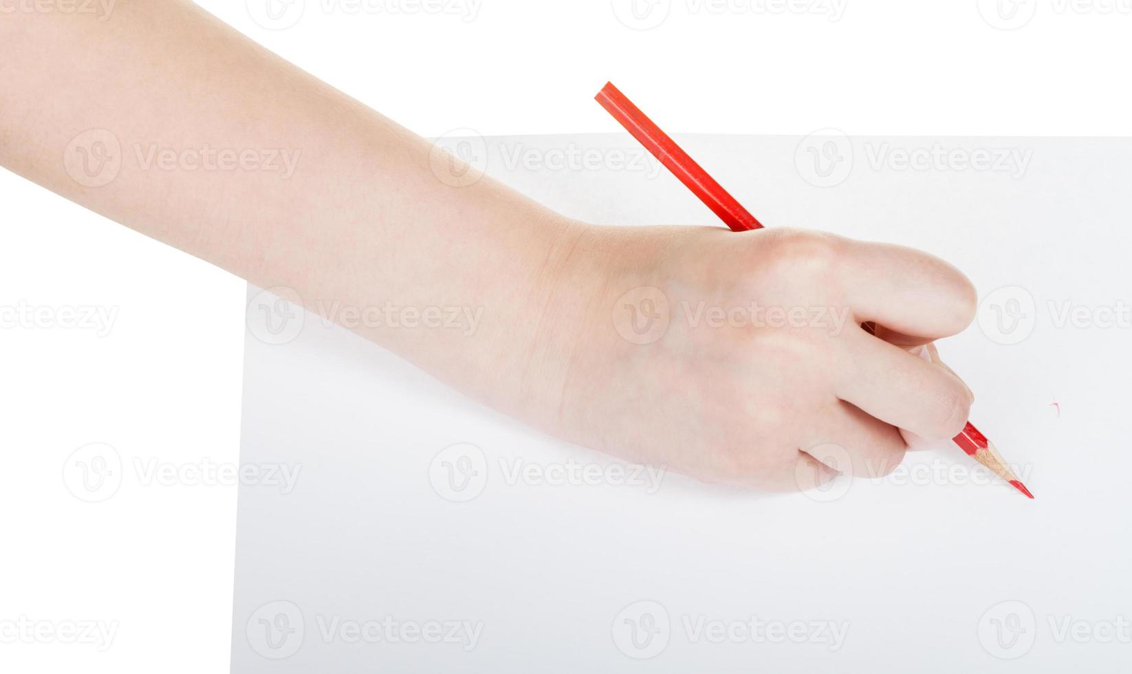 hand writes by red pencil on sheet of paper photo