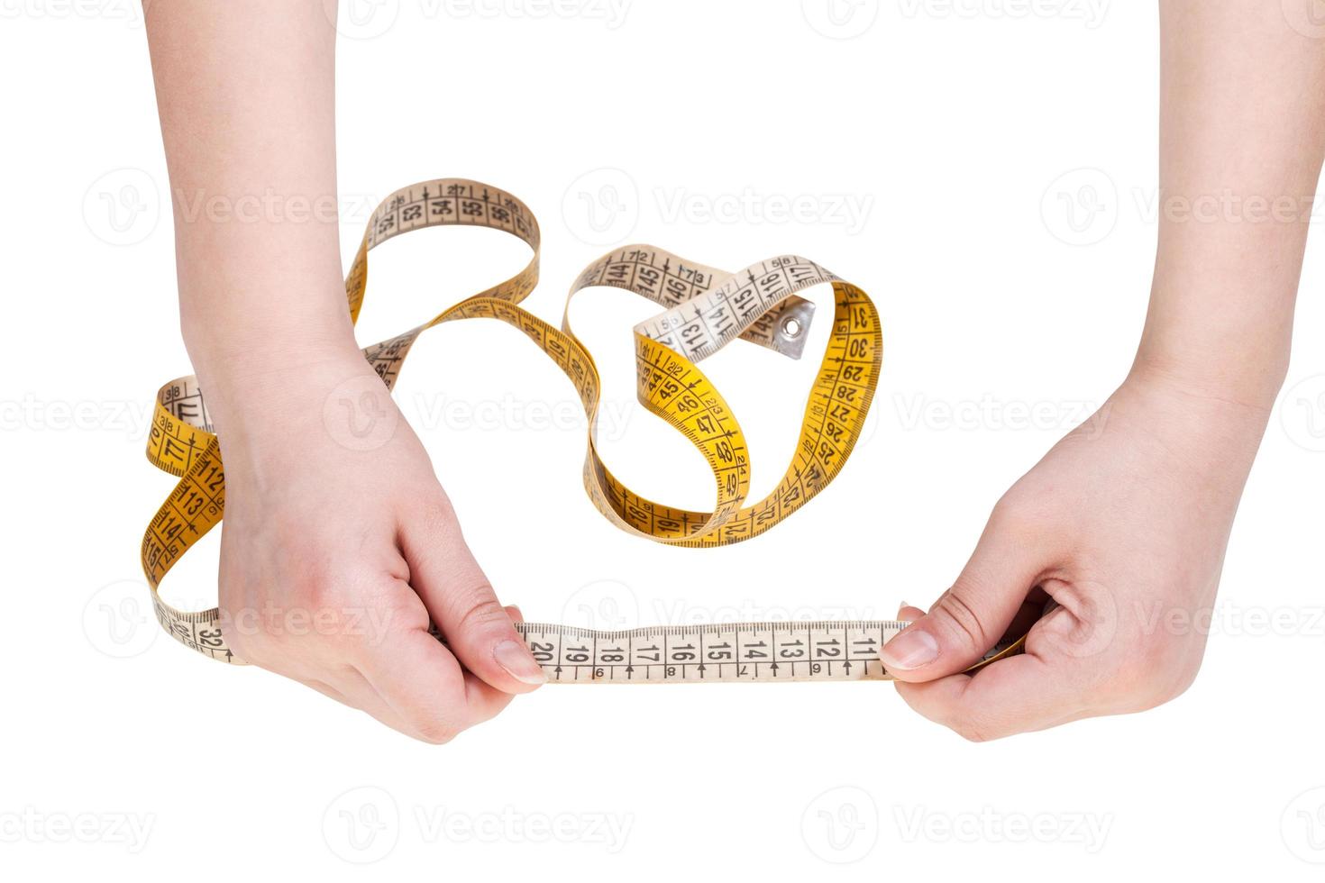 female hands with measuring tape line isolated photo