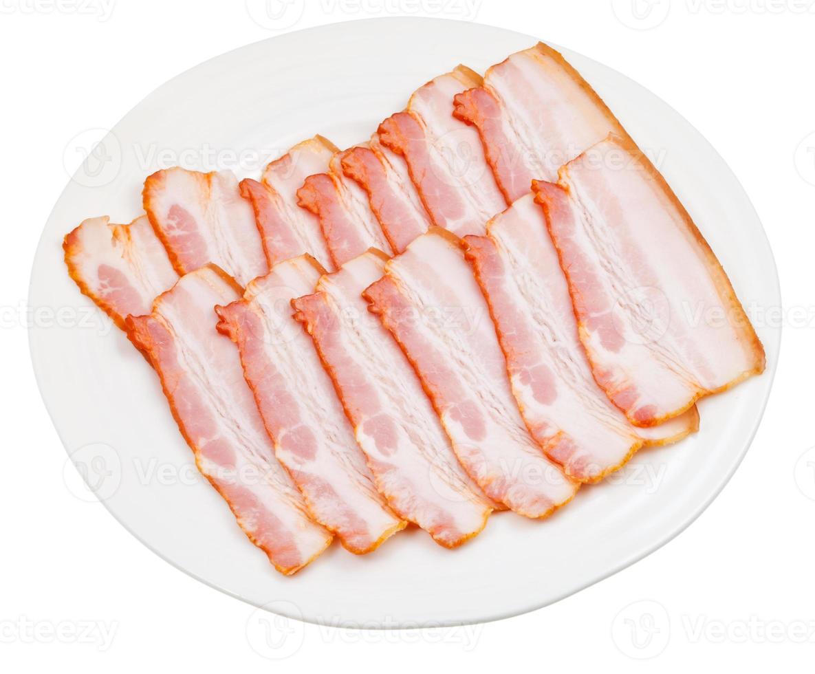 sliced bacon on white plate photo