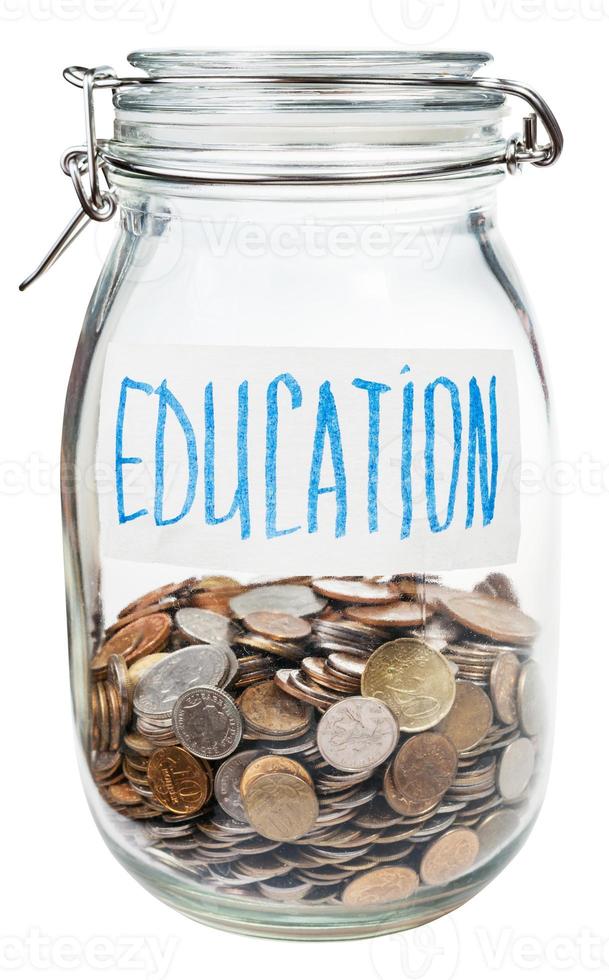 saved coins for education in closed glass jar photo