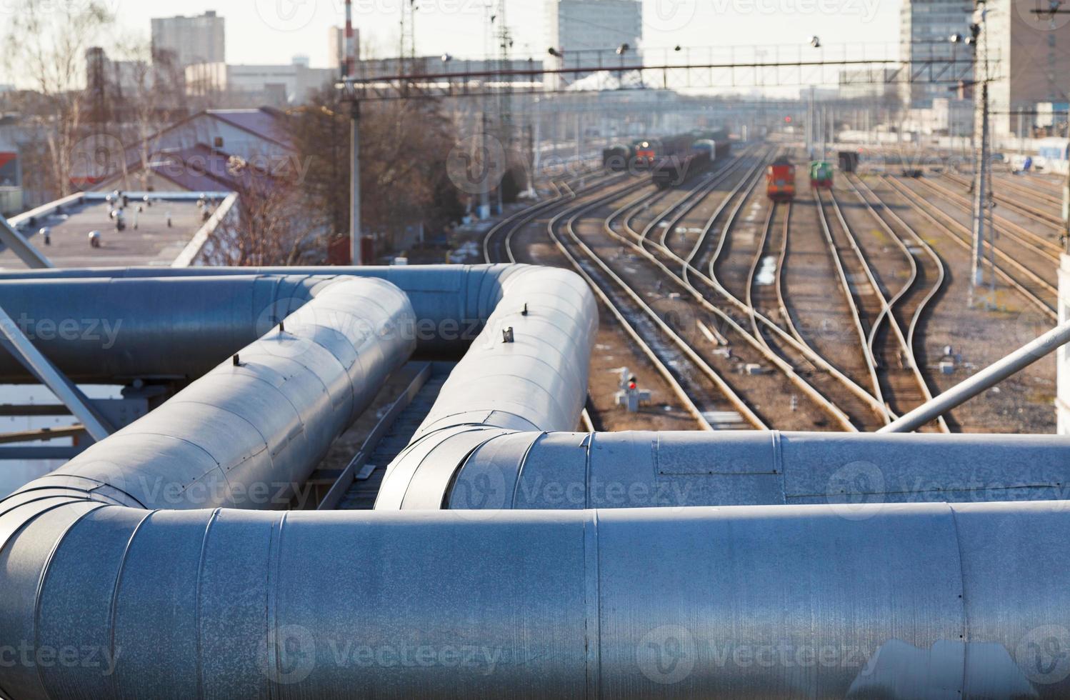 industrial view with pipeline and railway lines photo