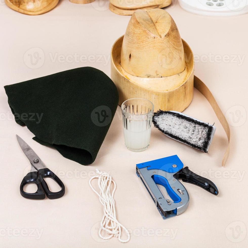 felt hood, wooden dummy and tools for millinery photo
