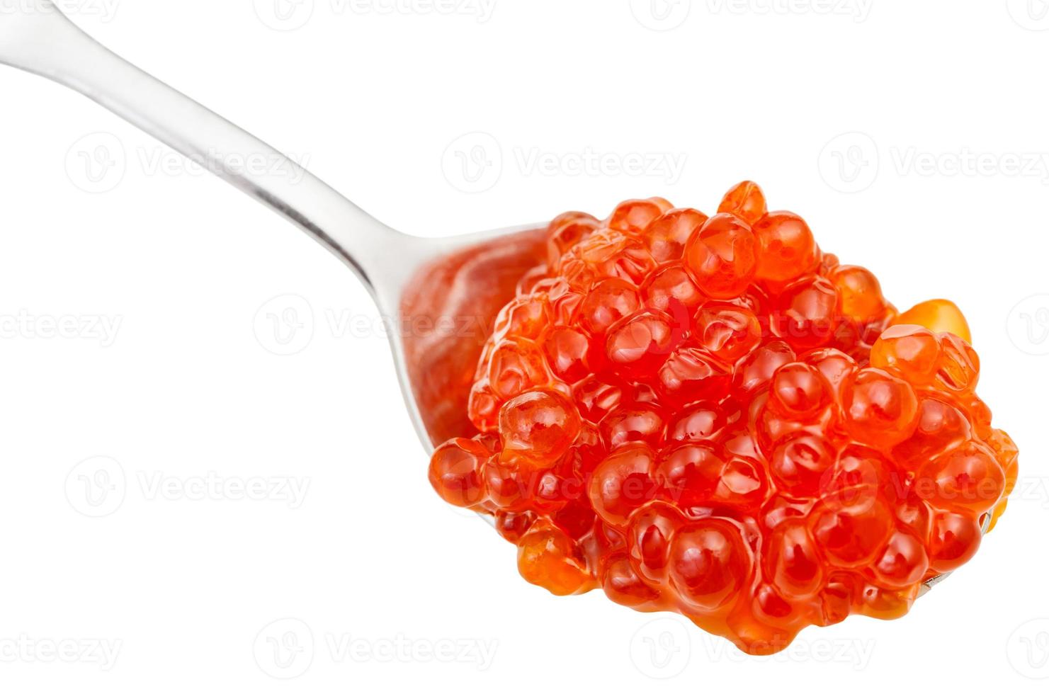 Cuchara con caviar rojo salmón trucha aislado foto