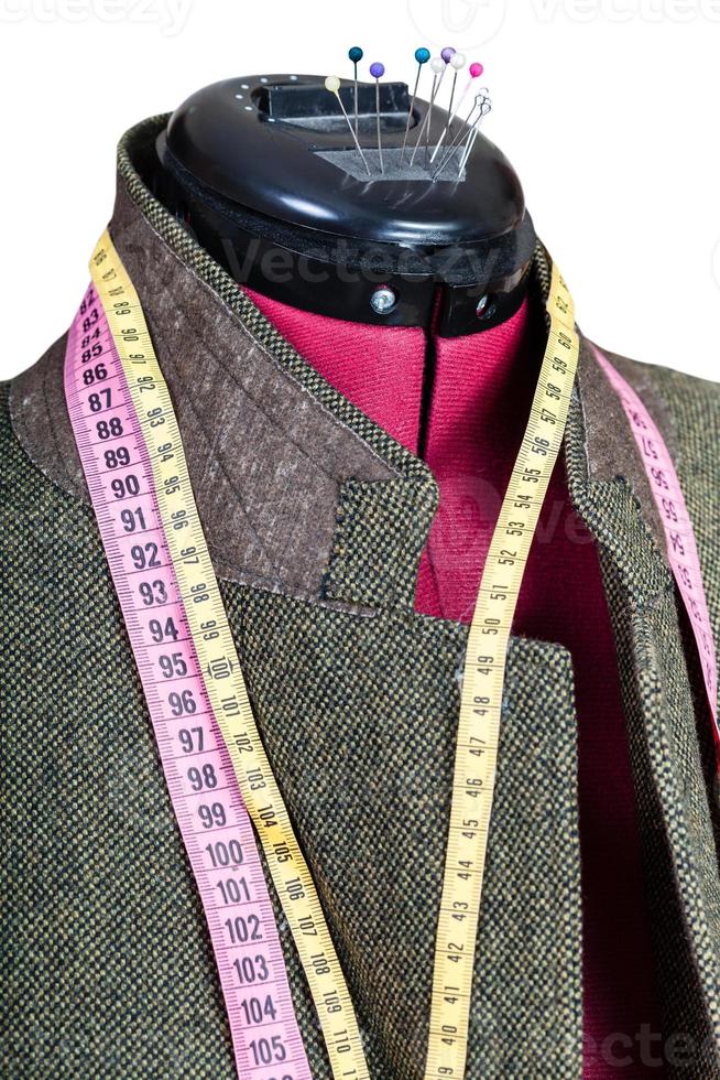 tailoring of man tweed jacket on mannequin photo