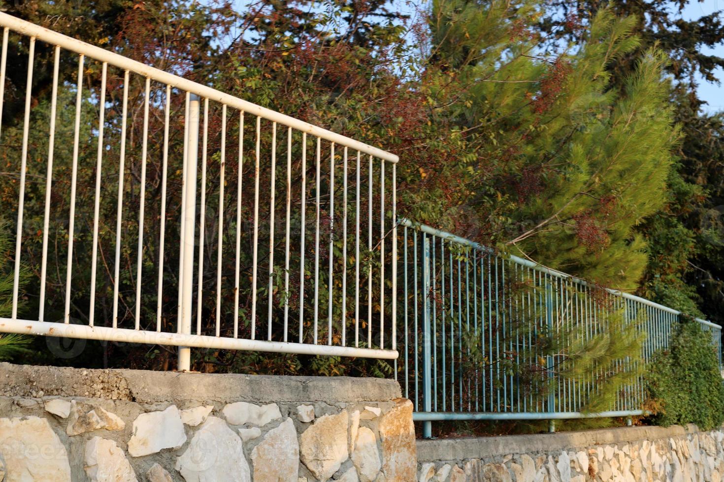 Fence in the city park on the shores of the Mediterranean Sea. photo