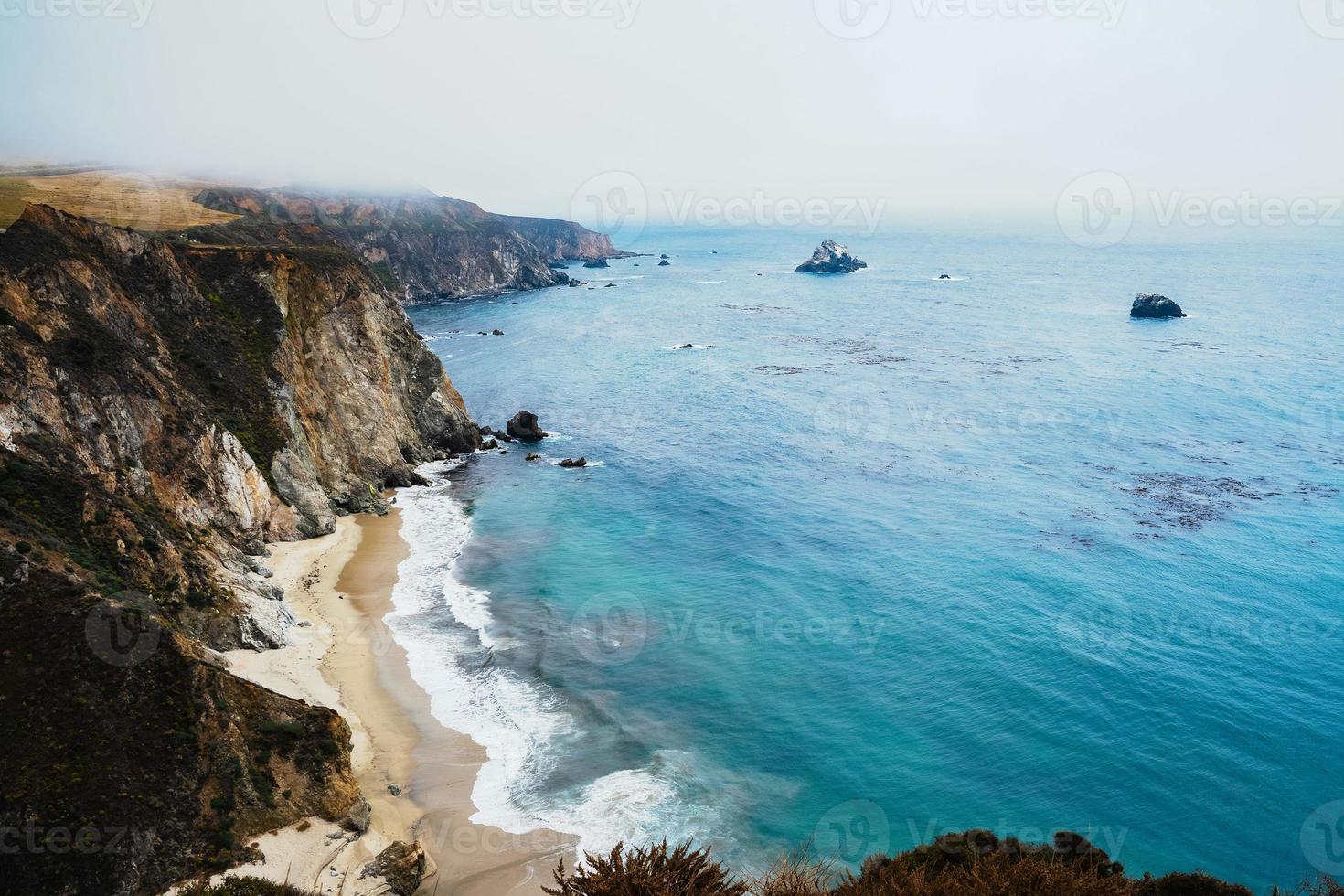 Pacific ocean beach and cliffs photo